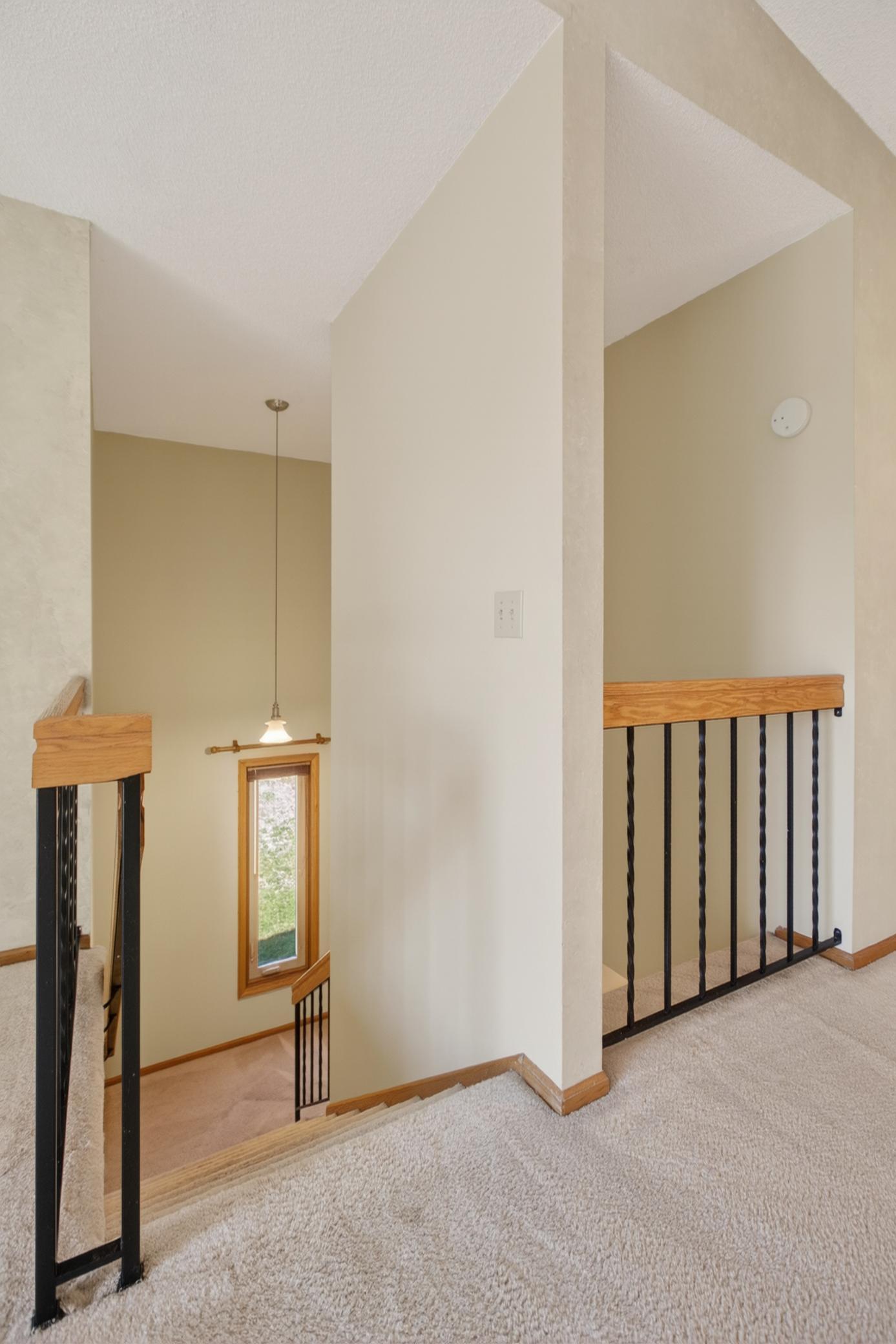 Two-story staircase with open entryway