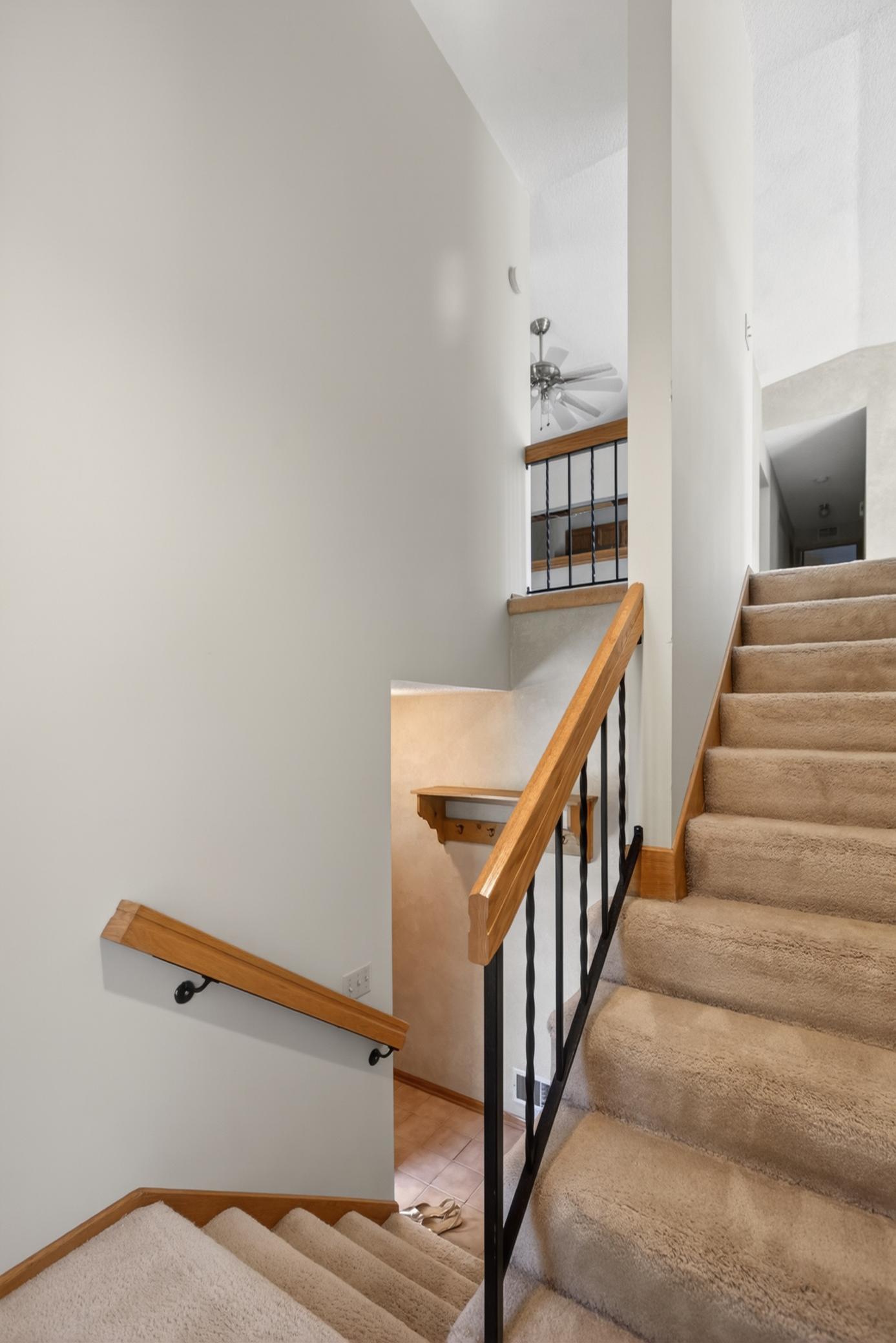 Two-story staircase with open entryway