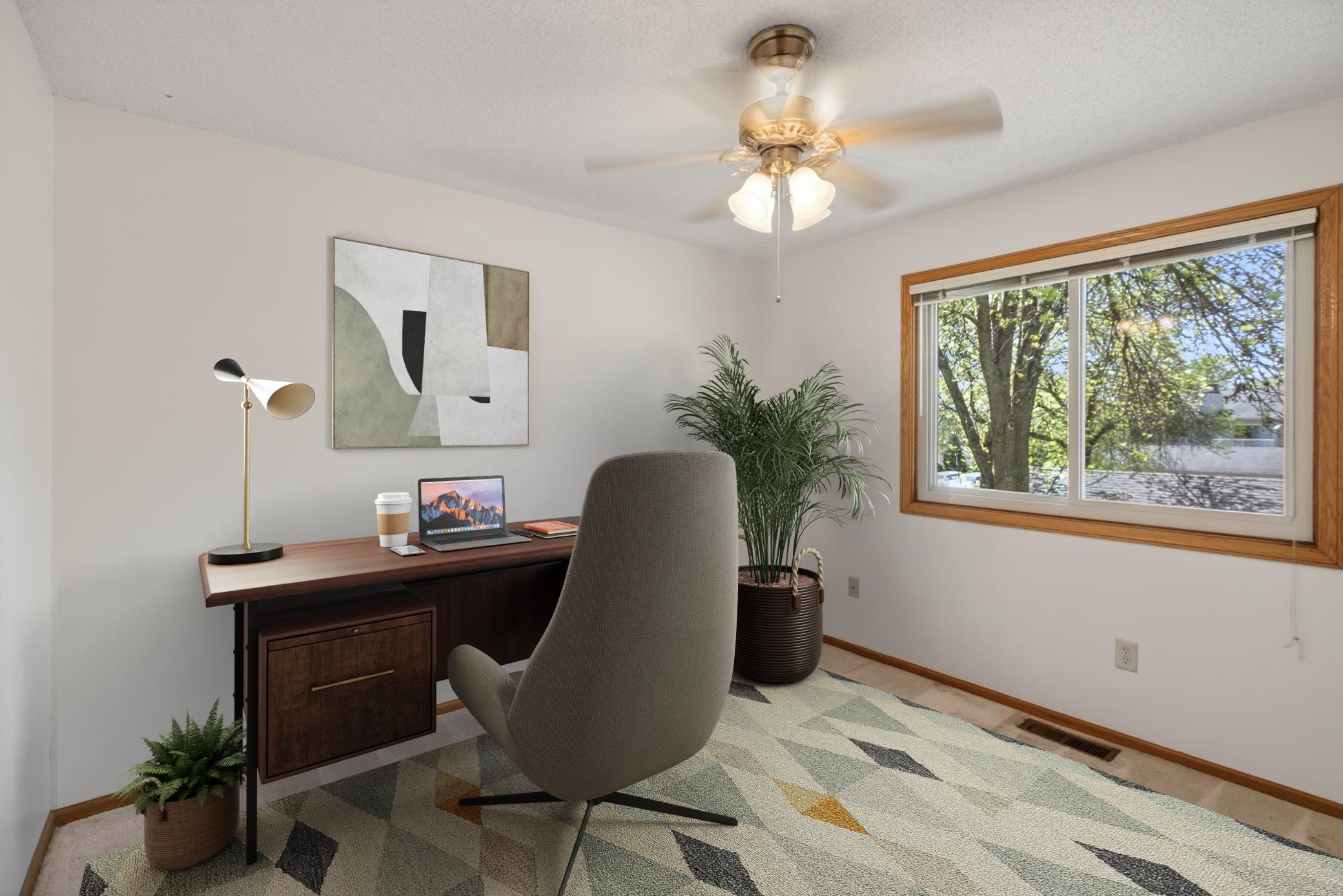 Second bedroom ideal for guests, office, or flex space. virtually staged.