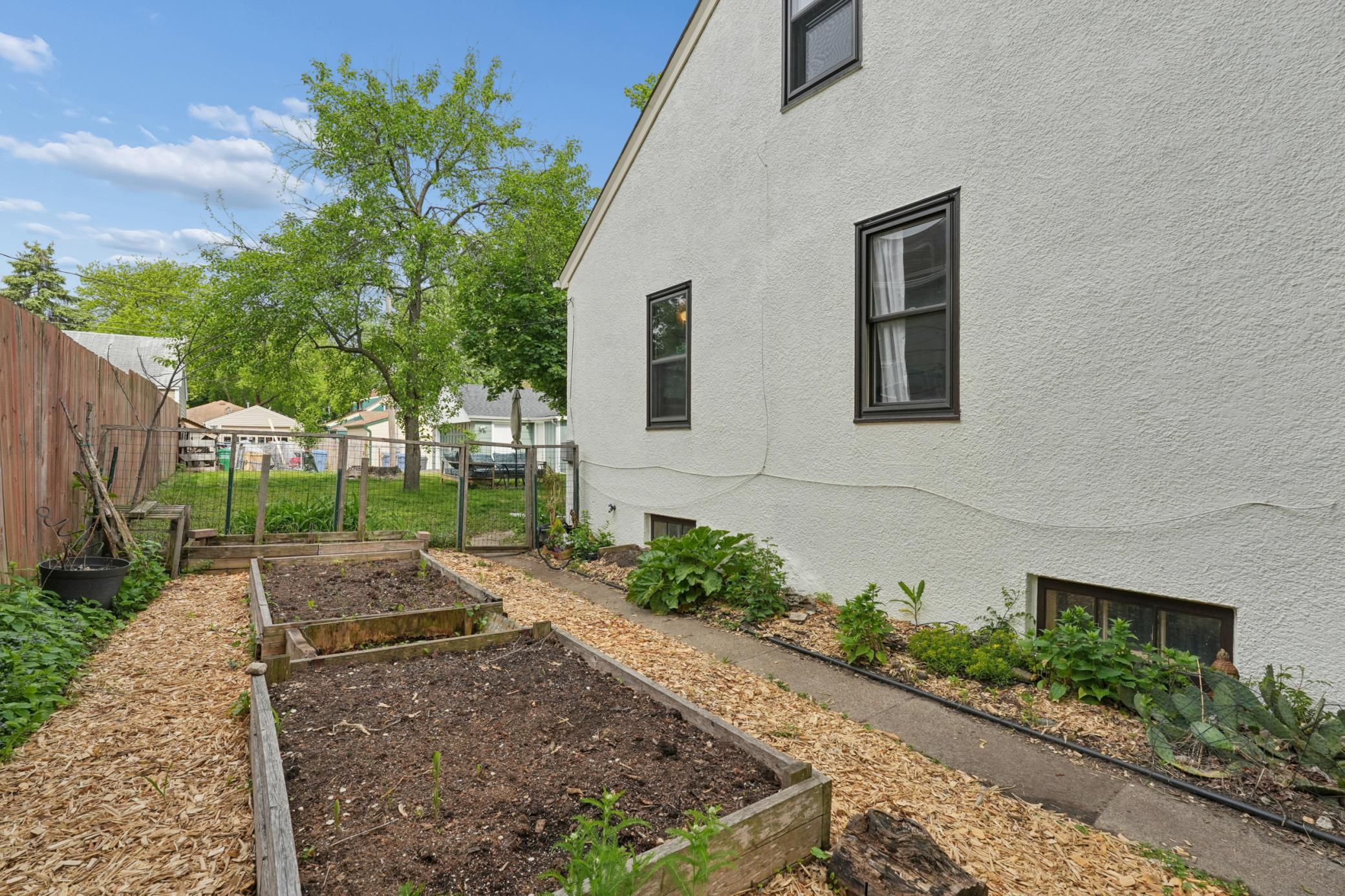Raised beds on the south side of the home - ready for veggies or annuals!
