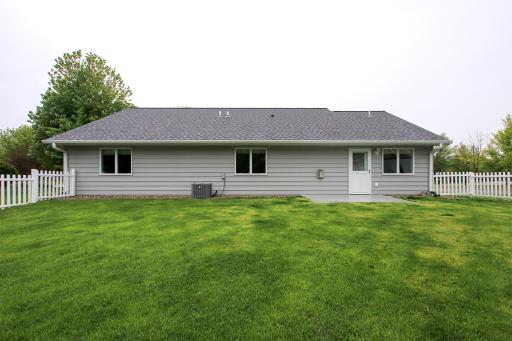 There is a small concrete patio area in the fenced in backyard, perfect for playing with pets or children.