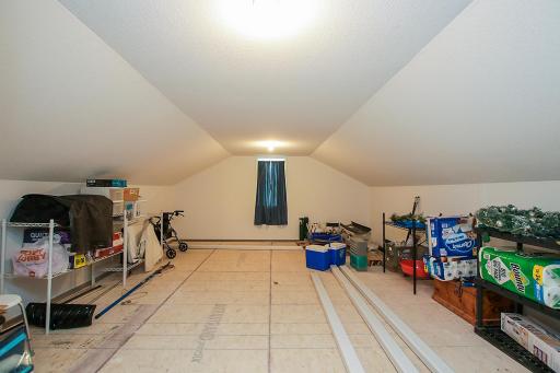 The walk-up bonus room is nearly 400 sq feet and is accessed through the garage. It has a finished ceiling and walls. Add some flooring and connect to the homes HVAC and you have additional year-round space!