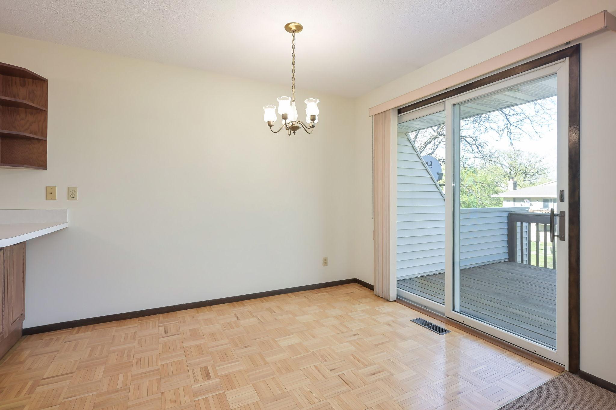 Dining Room with access to deck and retro parquet flooring!