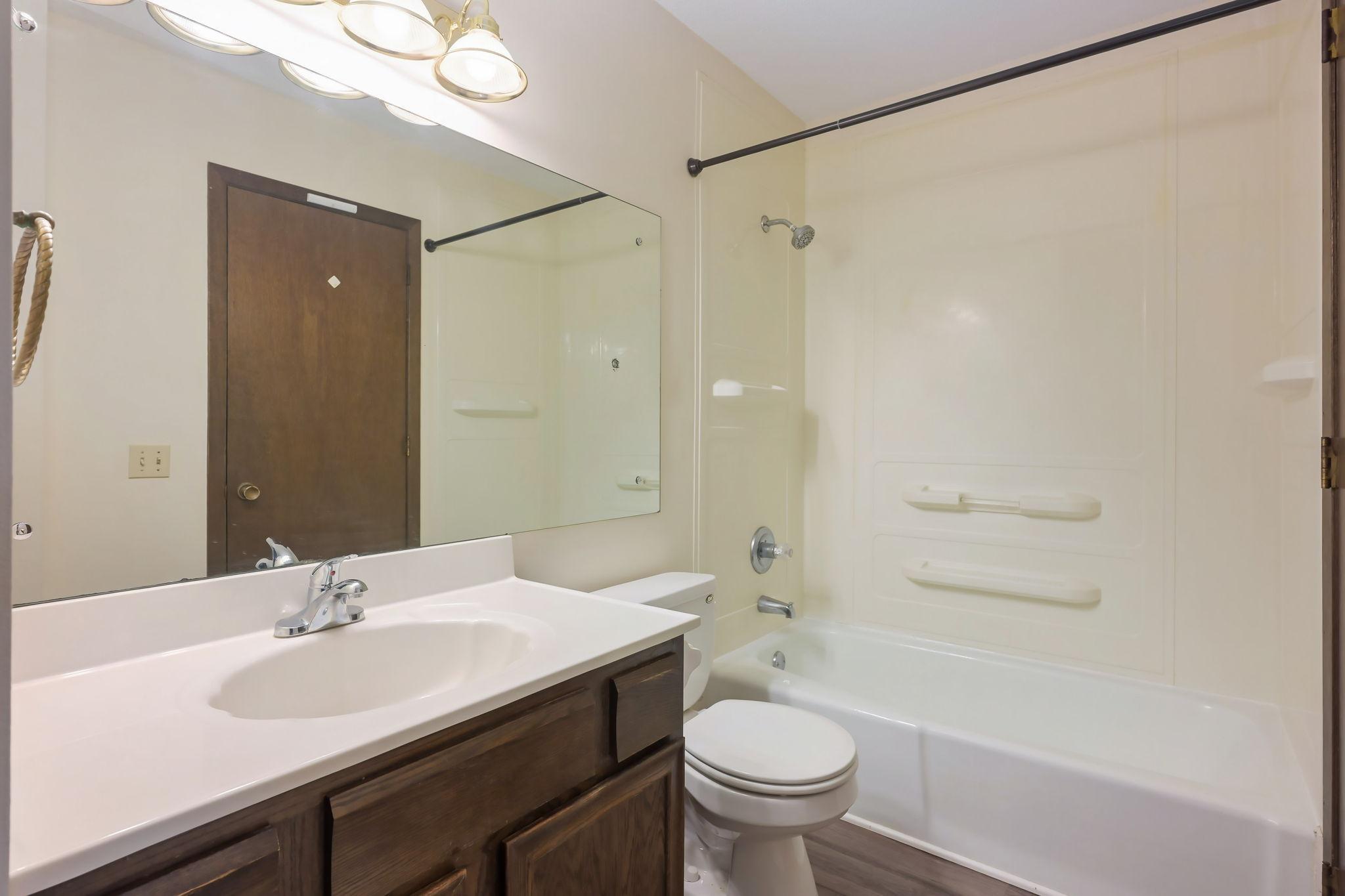 Walk-thru bathroom has new LVT floor and subfloor