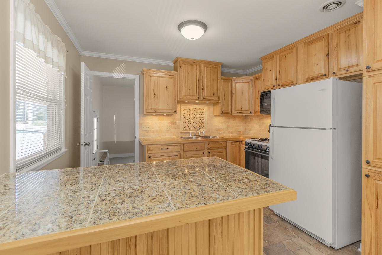 Kitchen Door that leads to outside side door as well as lower level