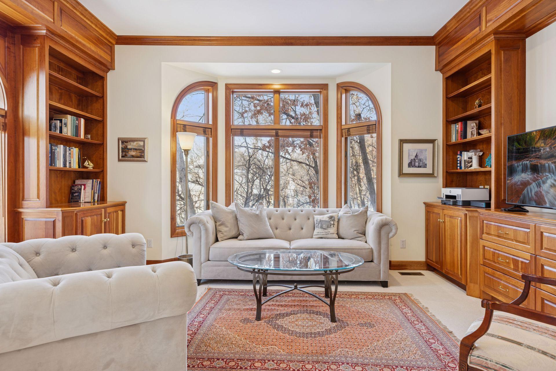 With windows on two sides, including a charming bay window and a cozy window seat, this corner family room is filled with natural light throughout the day