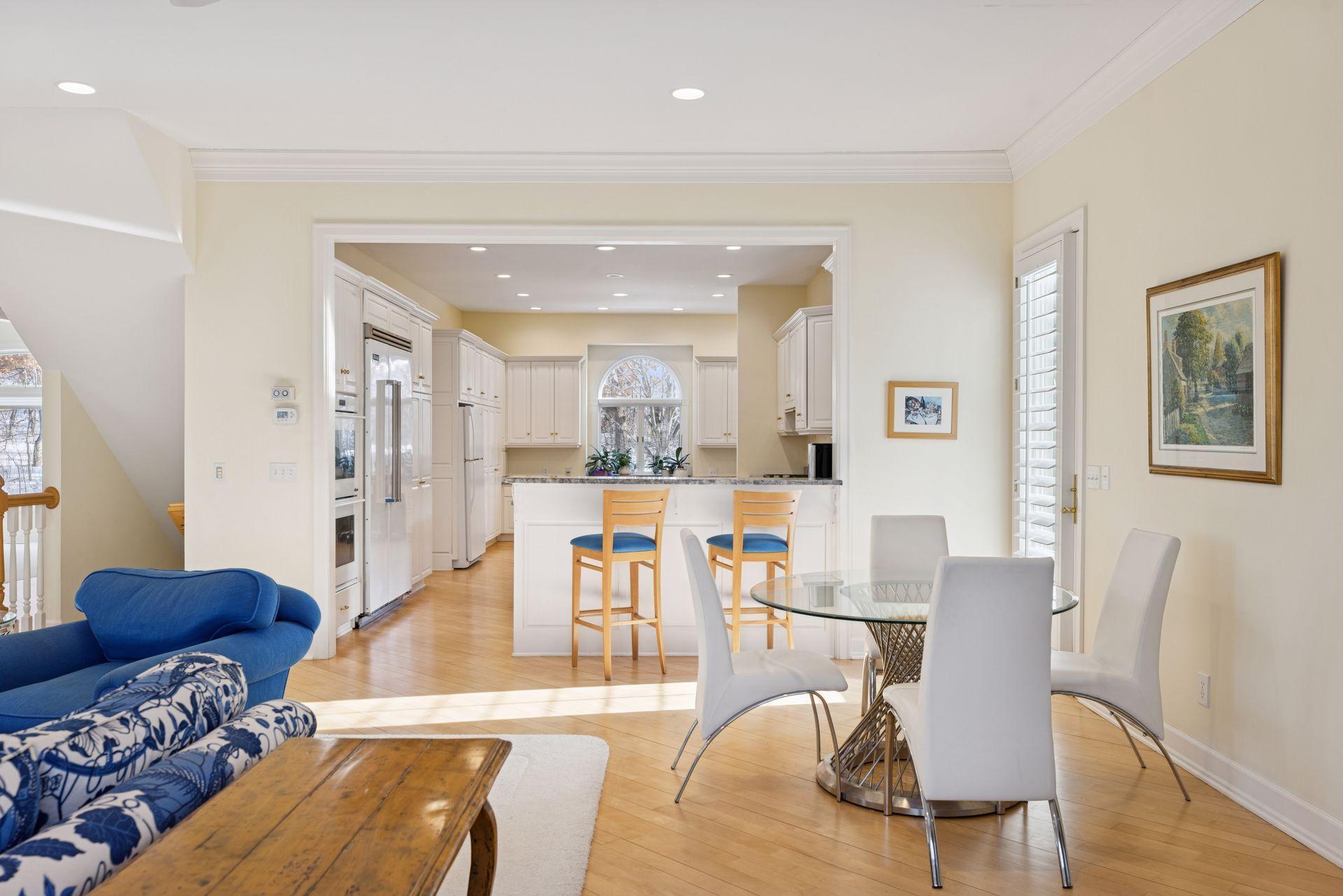 The breakfast bar opening keeps the kitchen within easy reach, with space for a casual dining table that works for everyday meals or extra seating when entertaining