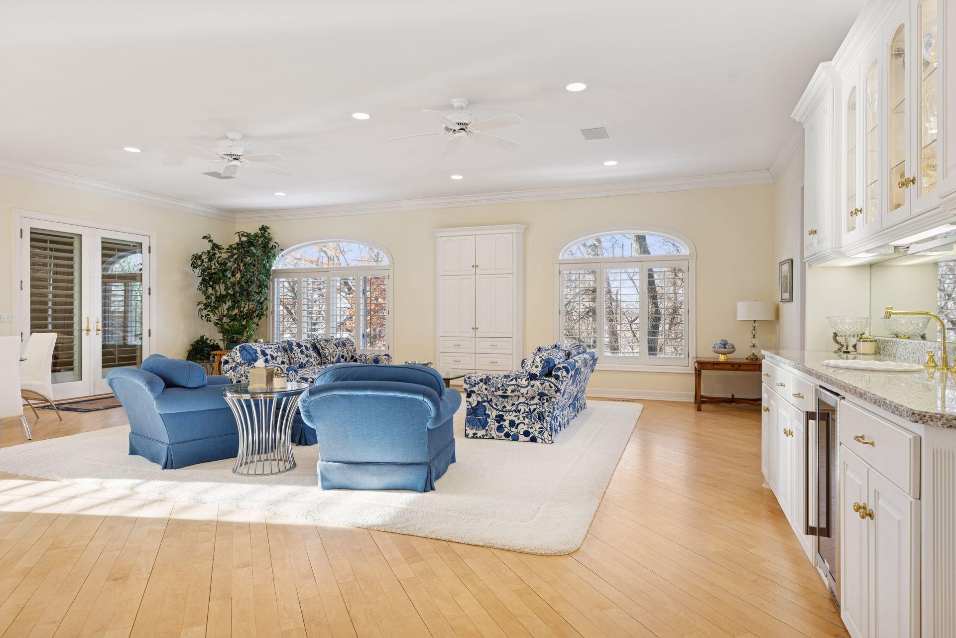 Ten-foot ceilings with recessed lighting create a bright yet comfortable atmosphere while the open flexible layout easily supports multiple seating arrangements and entertaining styles without feeling crowded
