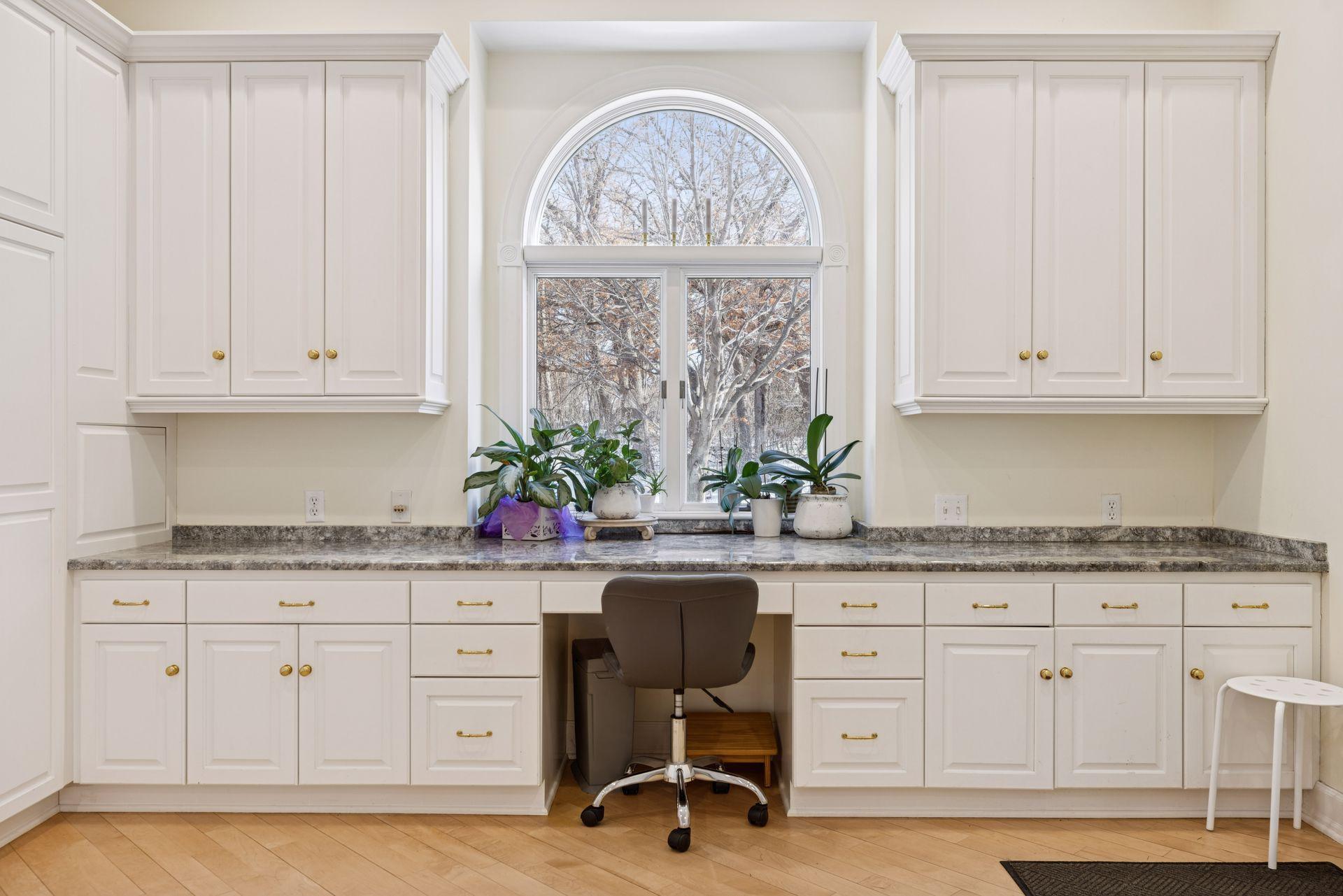 A dedicated work or office area within the kitchen adds a practical spot for planning, homework, or staying connected while meals come together