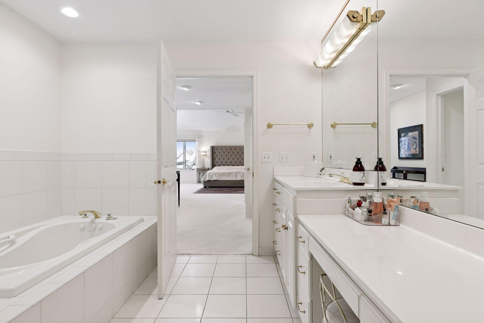 The primary suite boast 2 bathrooms, a full bath with walk-in shower, soaking tub and multilevel vanity while the second primary bath features a spacious raised vanity and oversized walk-in shower