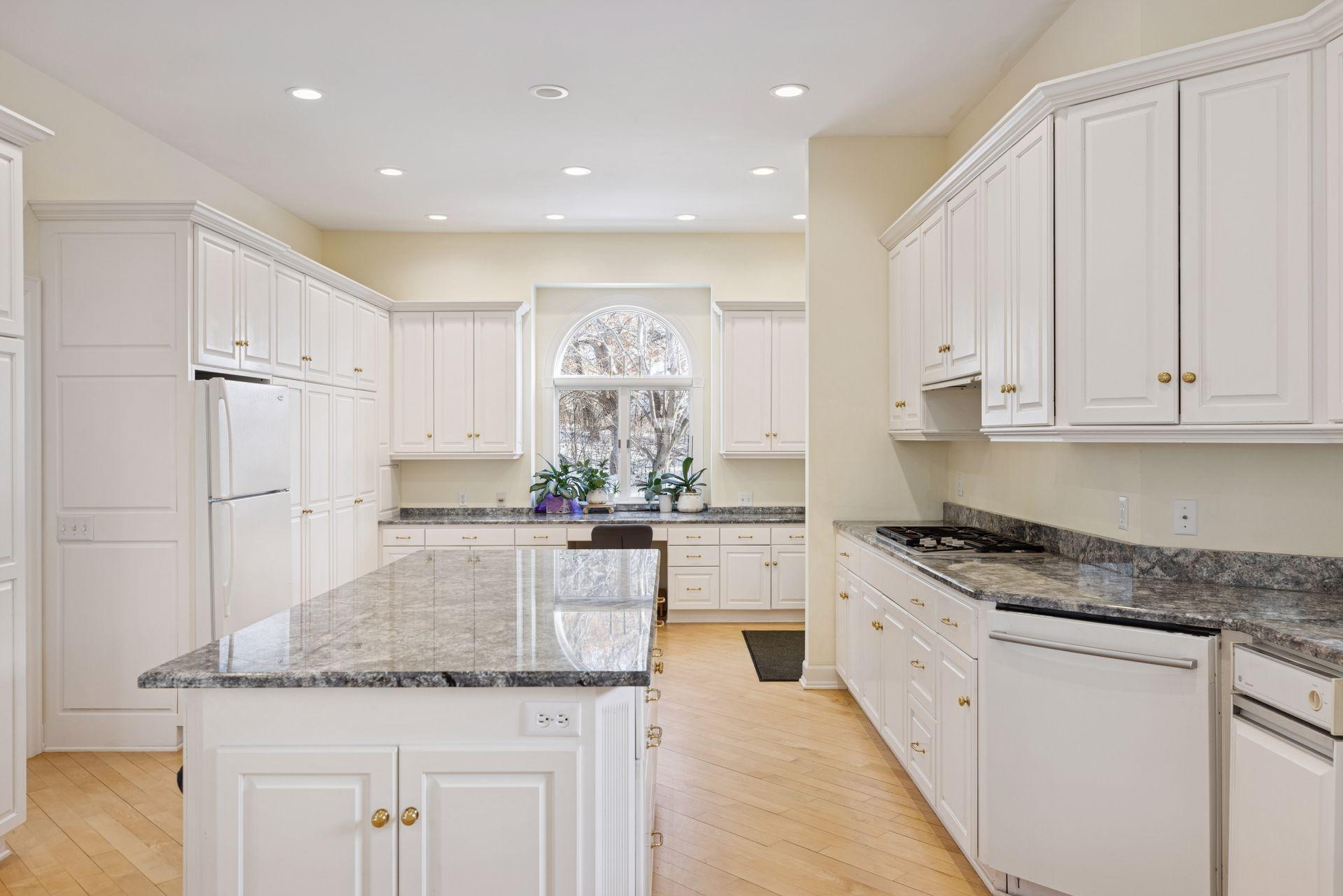 Abundant cabinetry keeps everything organized and out of sight, with room for everything from everyday essentials to entertaining pieces