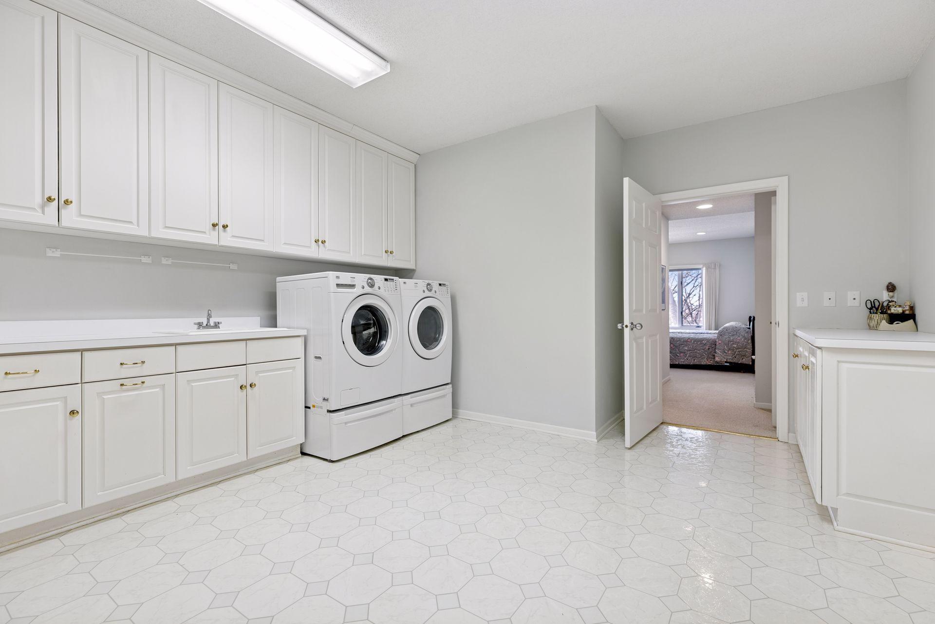Enormous laundry room with tons of storage and hobby space
