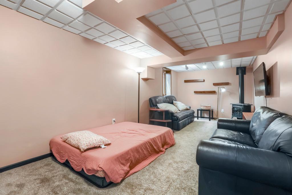 Another view of lower level family room with a gas firplace.jpg