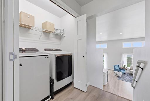 Laundry Room Upper Level - Laminated Vinyl Plank In Hallway, Laundry and Bathroom for Function and Durability
