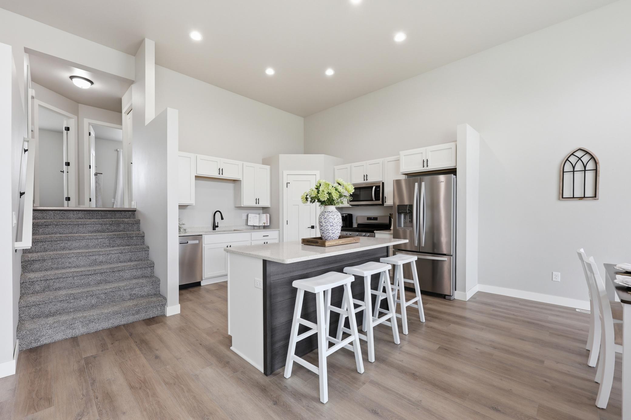 Kitchen Upgrades include: 5 Burner Gas Range, Exterior Vented Microwave, Quartz Counter Tops, & Soft Close Doors and Drawers