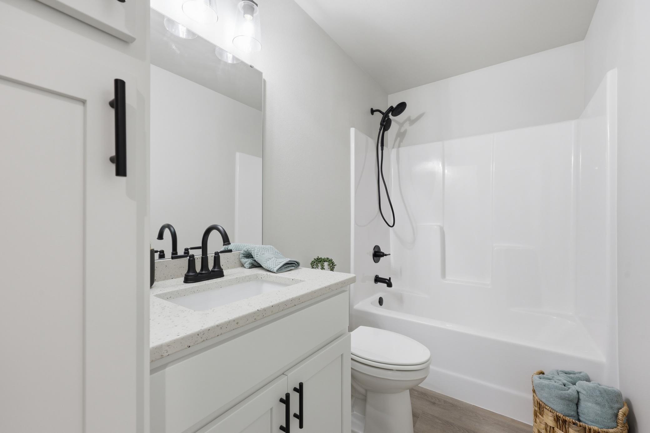 Full Bathroom In Lower Level with Linen Cabinet