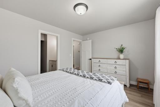 Primary Bedroom with Laminate Vinyl Plank Floors, Private Full Bath and Walk-In Closet