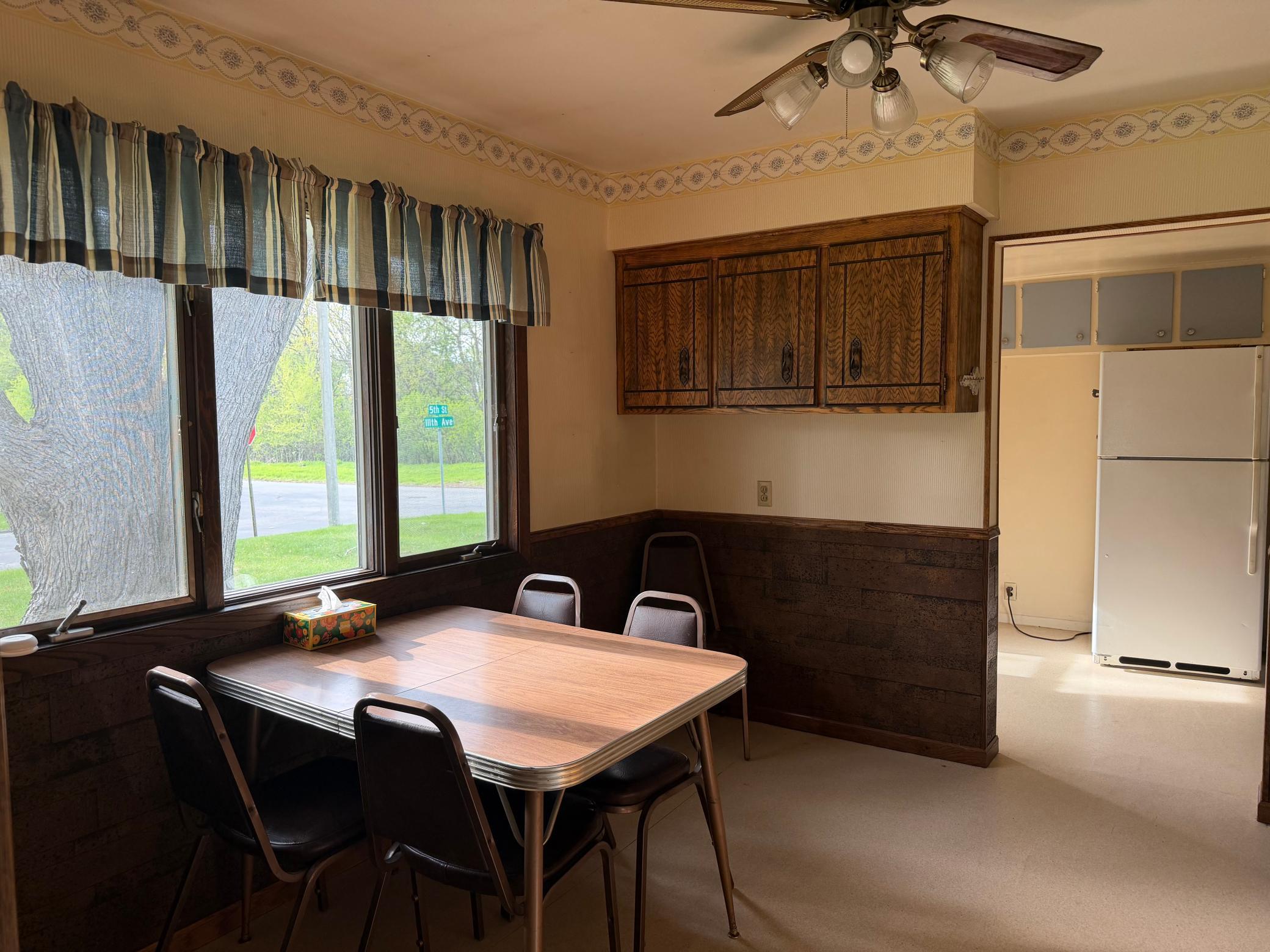 Additional cabinets on back wall and large window for natural daylight