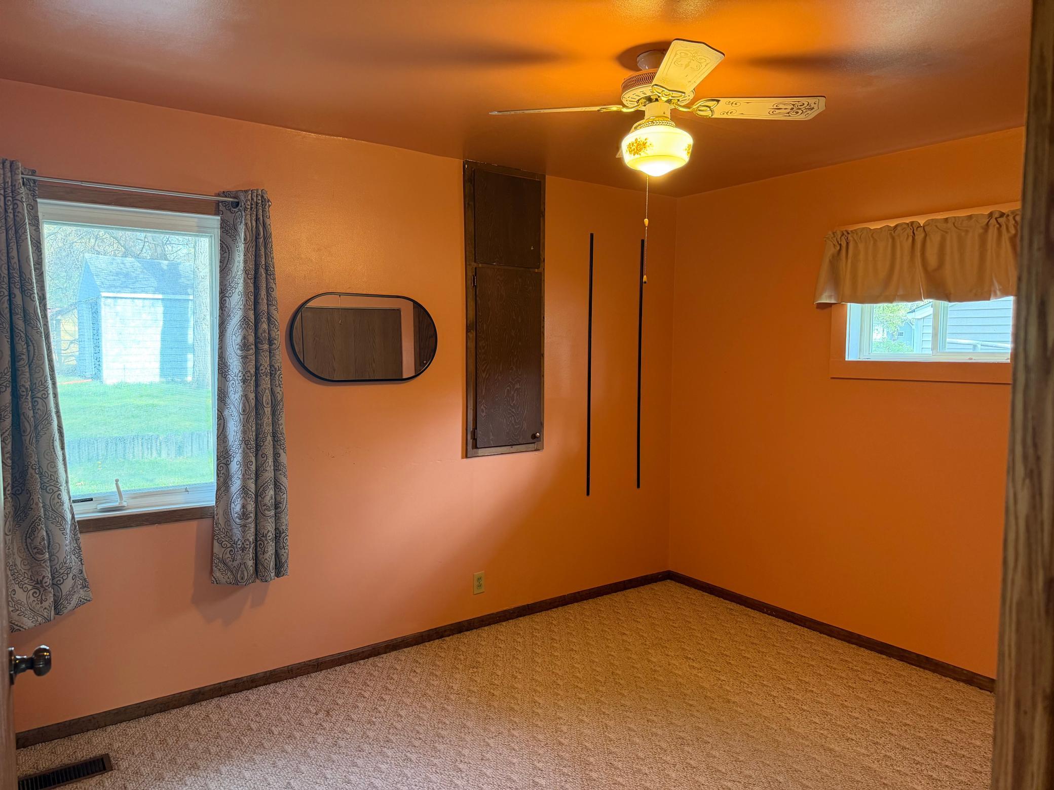 This bedroom has both a closet plus built in cabinets for wonderful storage