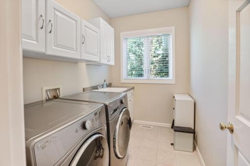 Main level laundry room right next to the garage entry