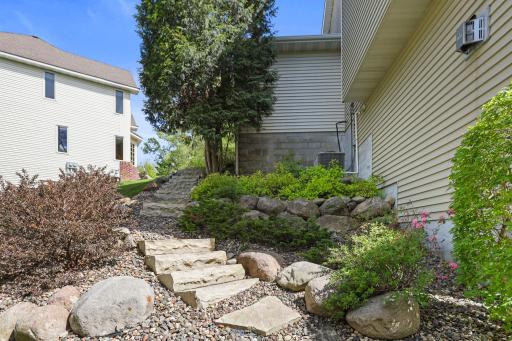 One of 2 paths leading down to the leveled landscaping and the lake