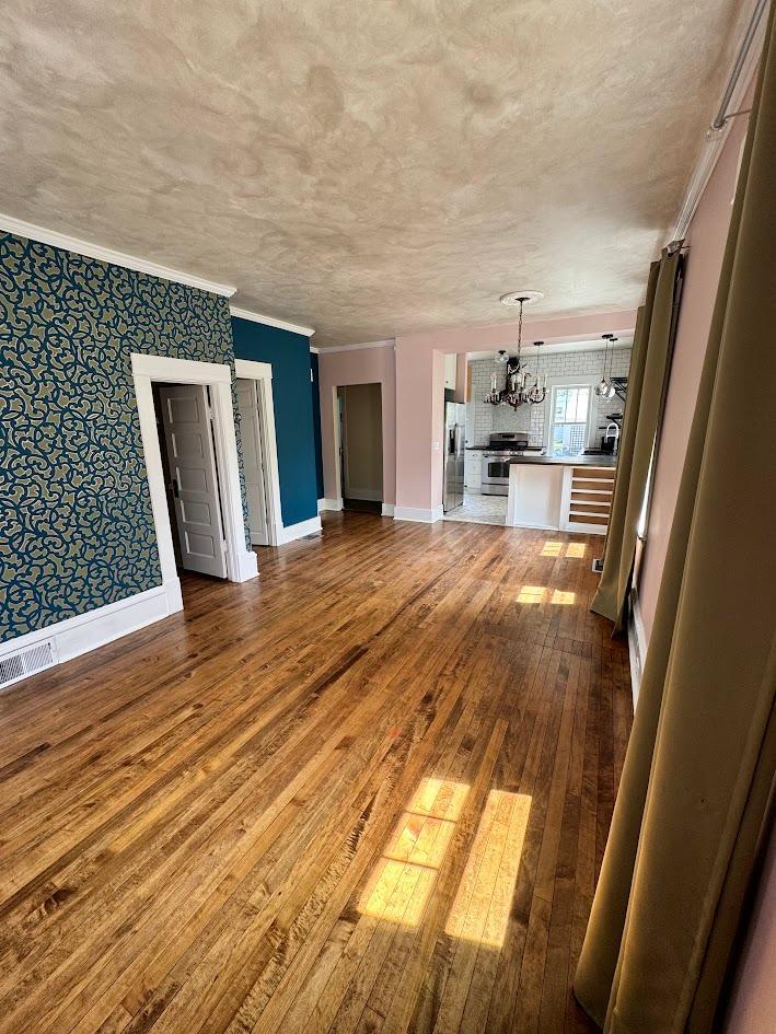 Living room to Kitchen view bedroom door & upper level & bathroom door