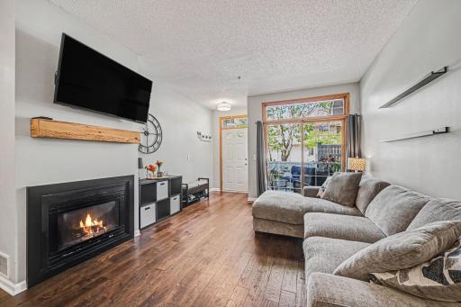 Living room patio doors with upper transom windows that fills the room with natural lighting.
