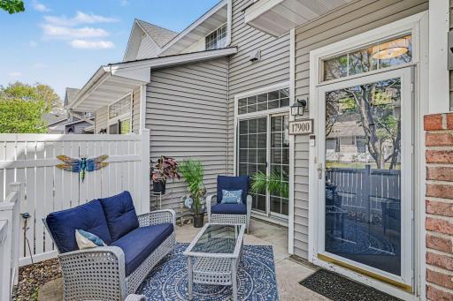 A serene private patio entry adds charm, privacy, and great curb appeal to this home.