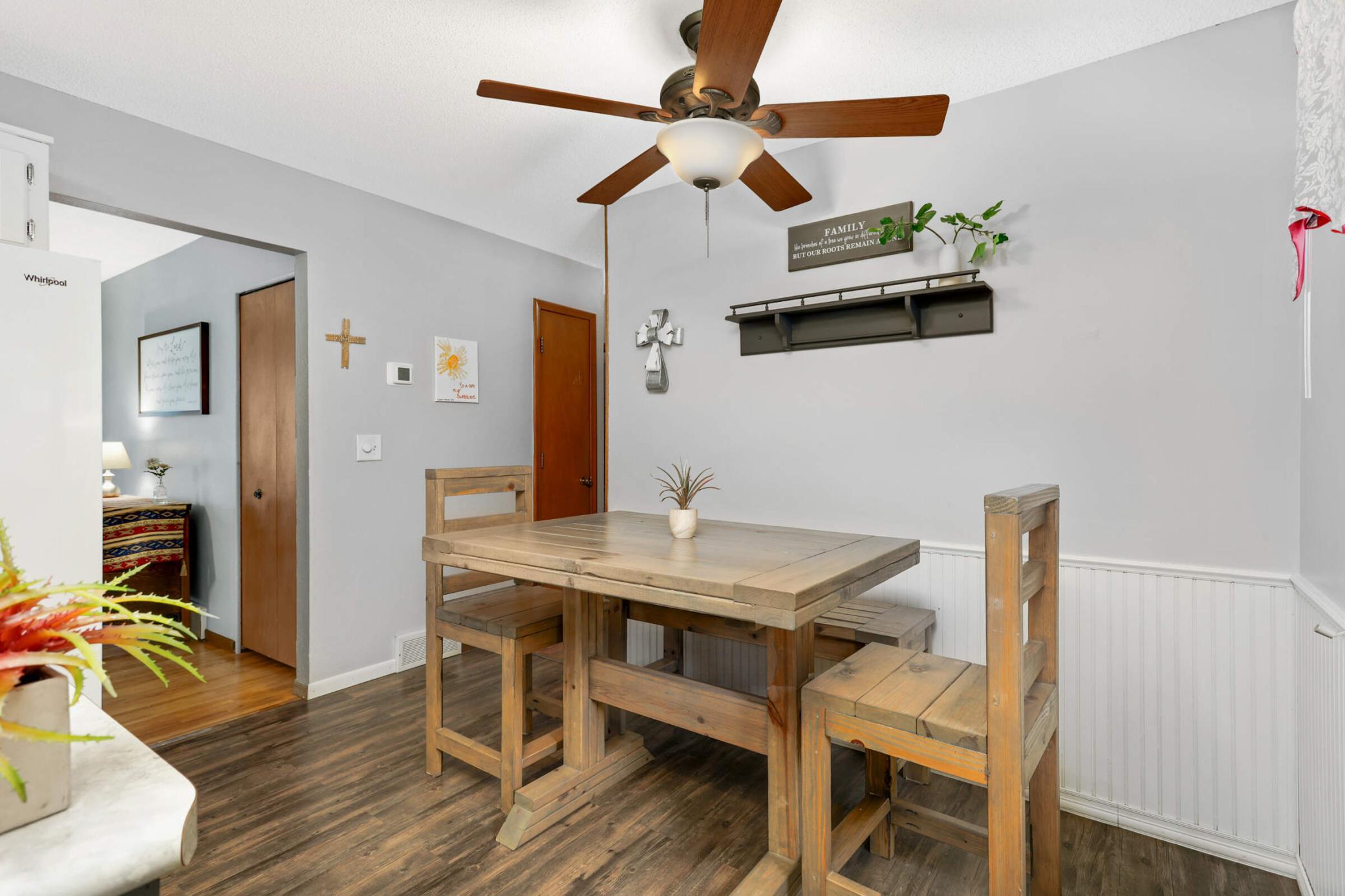 The eat-in dining area is perfectly positioned for everyday meals while overlooking the backyard and outdoor living spaces.