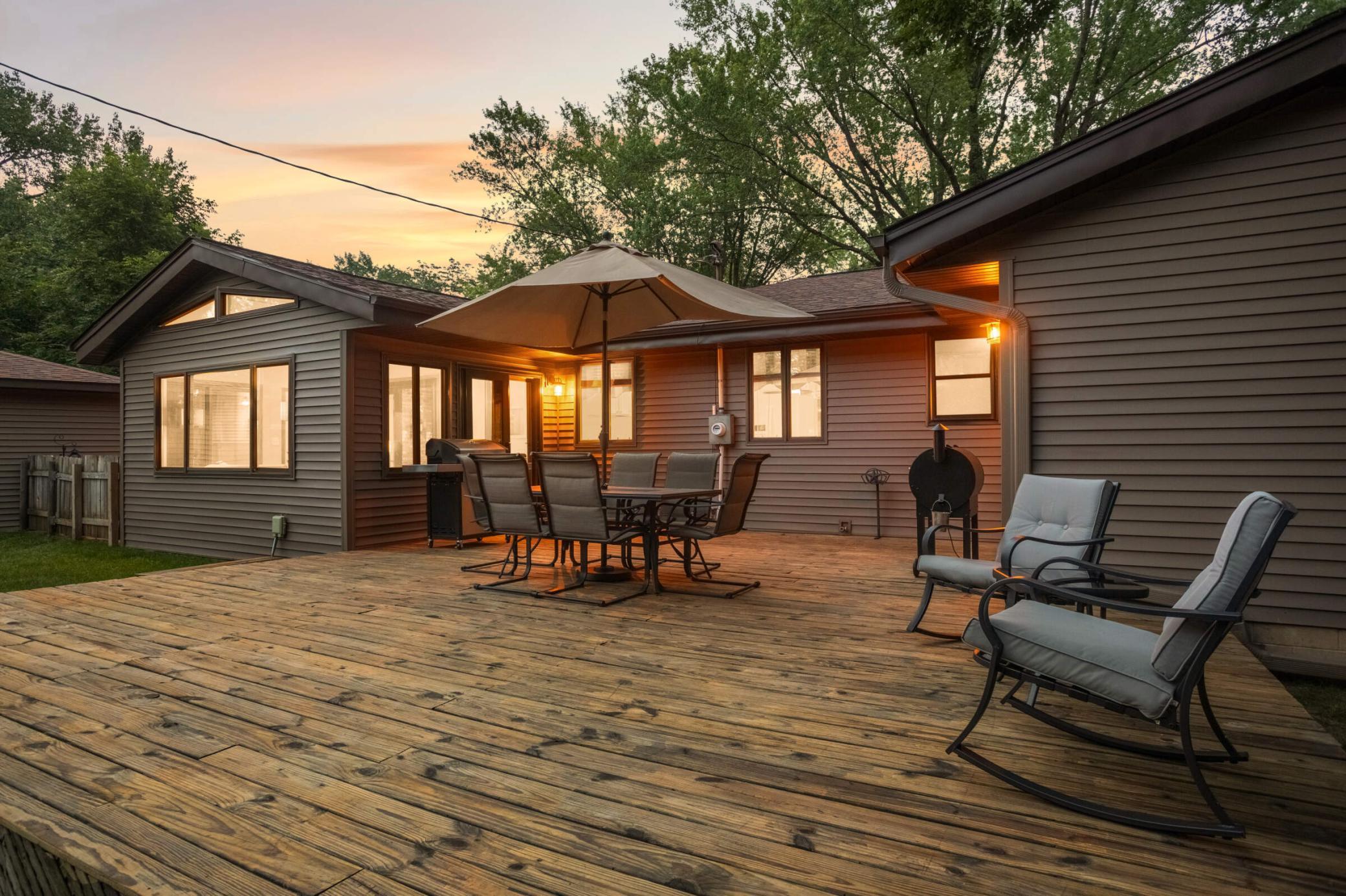 Outdoor patio/deck area creates the perfect setting for summer grilling, morning coffee, or relaxing evenings outdoors.