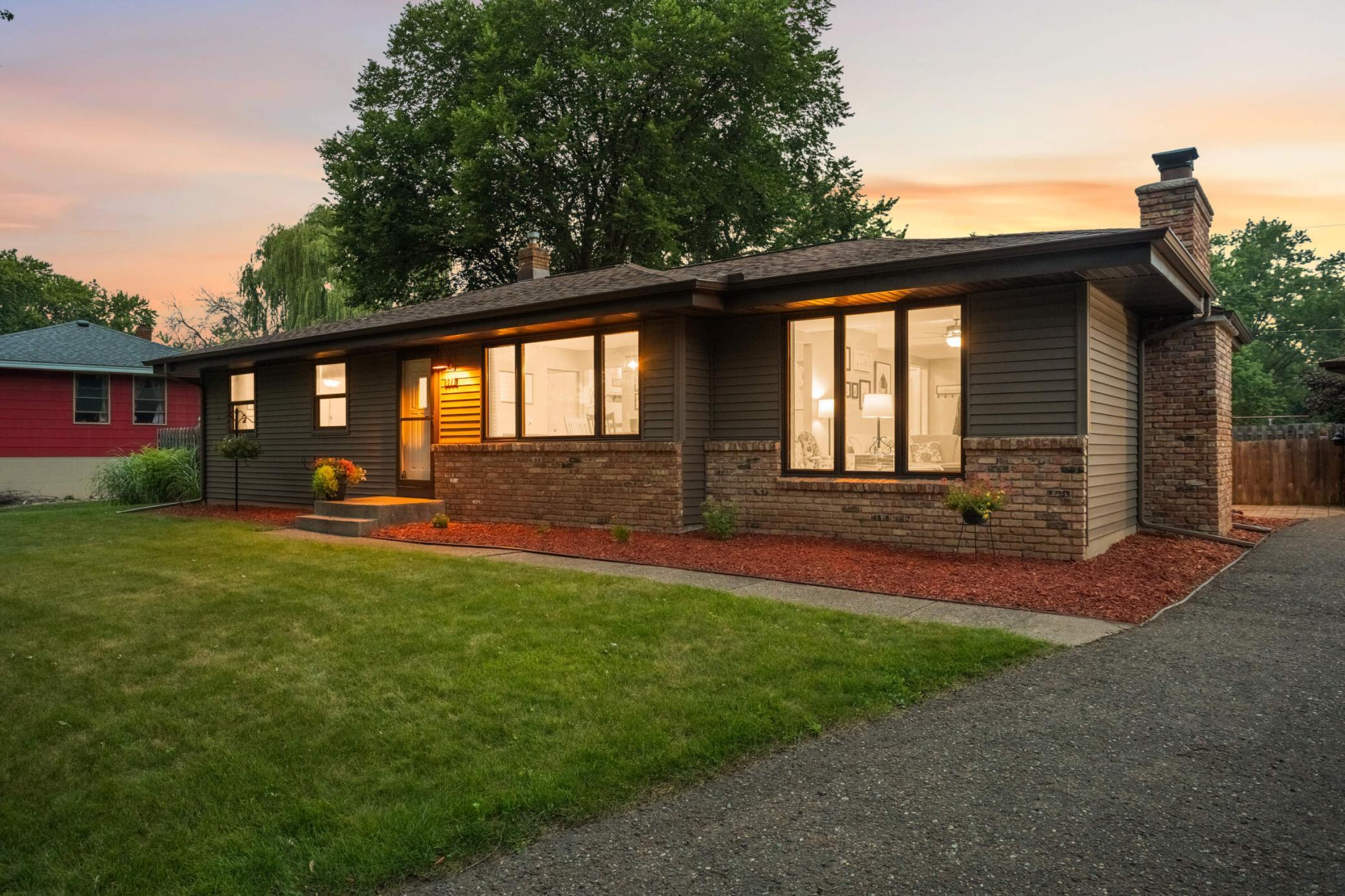 Beautifully maintained exterior with mature landscaping, inviting architecture, and a setting that immediately feels like home.