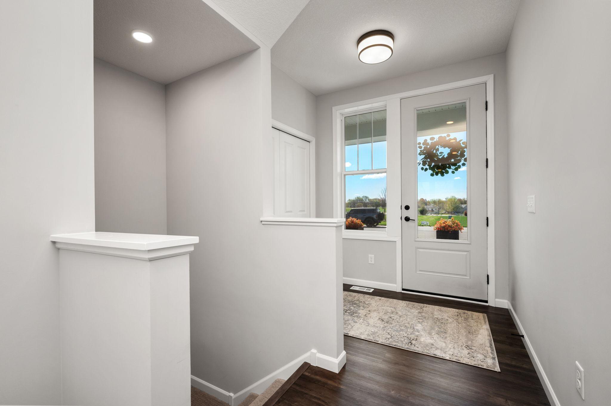Another view of this nice open foyer with entry coat closet for guests