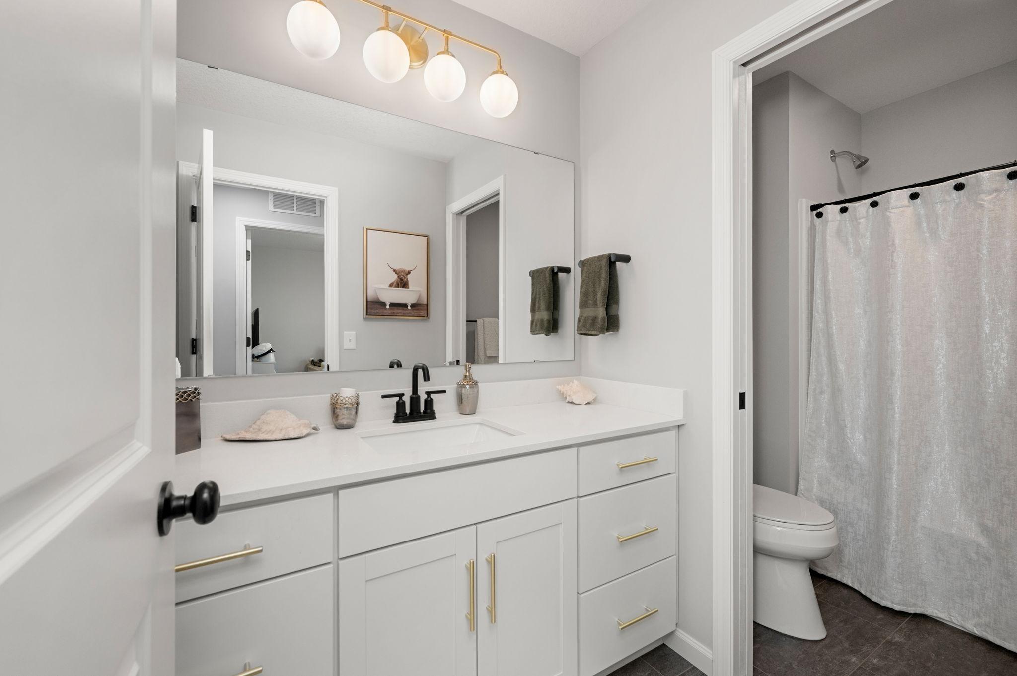 Additional full bath upper level with double vanity