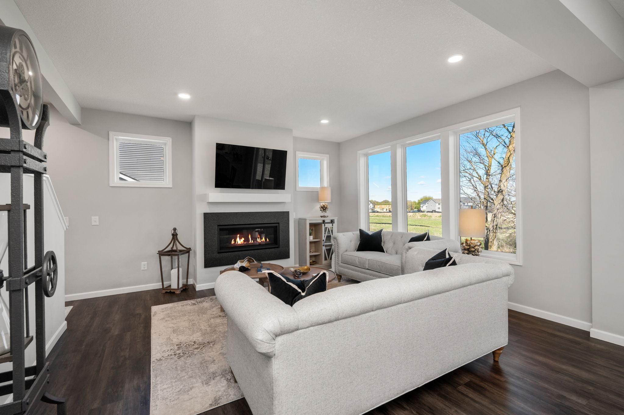 Main Floor Living Room with bright, open floor plan featuring 9-foot knock-down ceilings