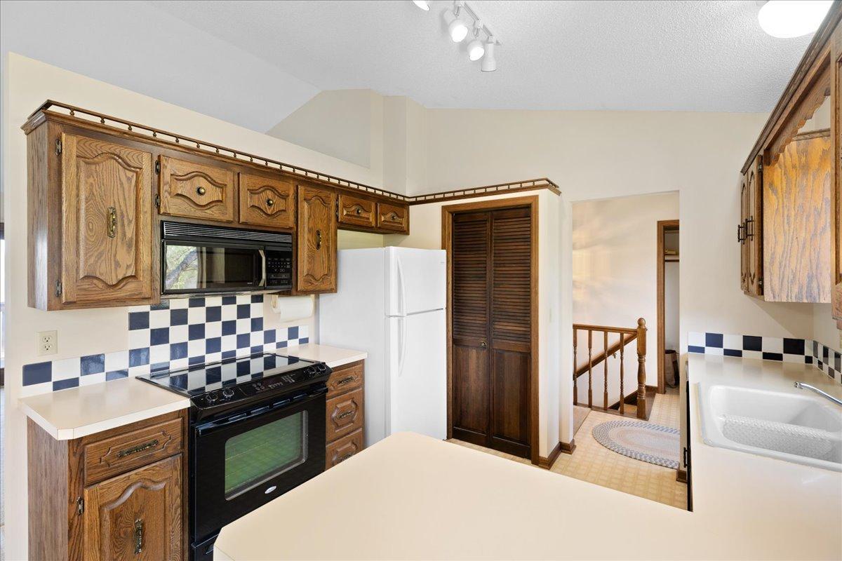 Nicely maintained kitchen featuring ample cabinetry and efficient workspace layout.