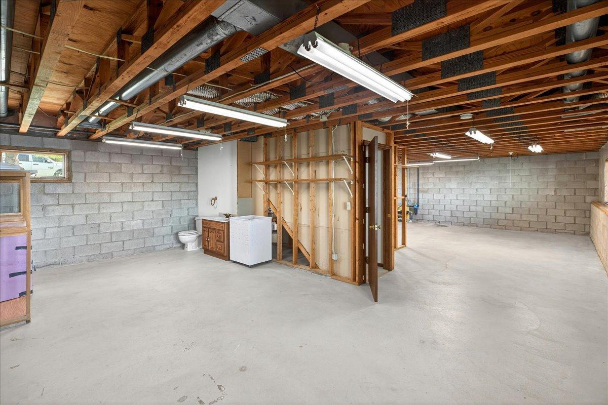 Lower-level 1/2 bath set-up ready for finishing touches and future expansion possibilities.