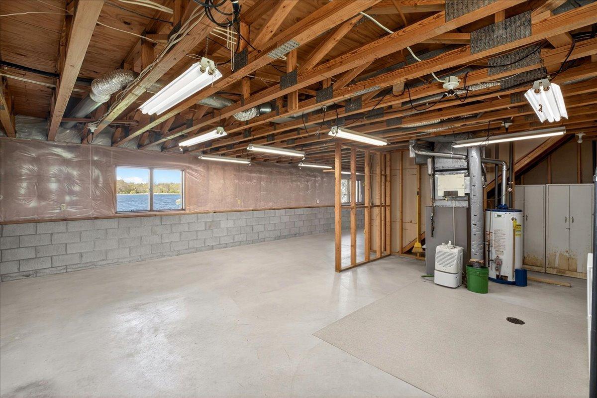 Expansive lower level offering abundant storage space, utility area, and opportunity to finish to your needs.