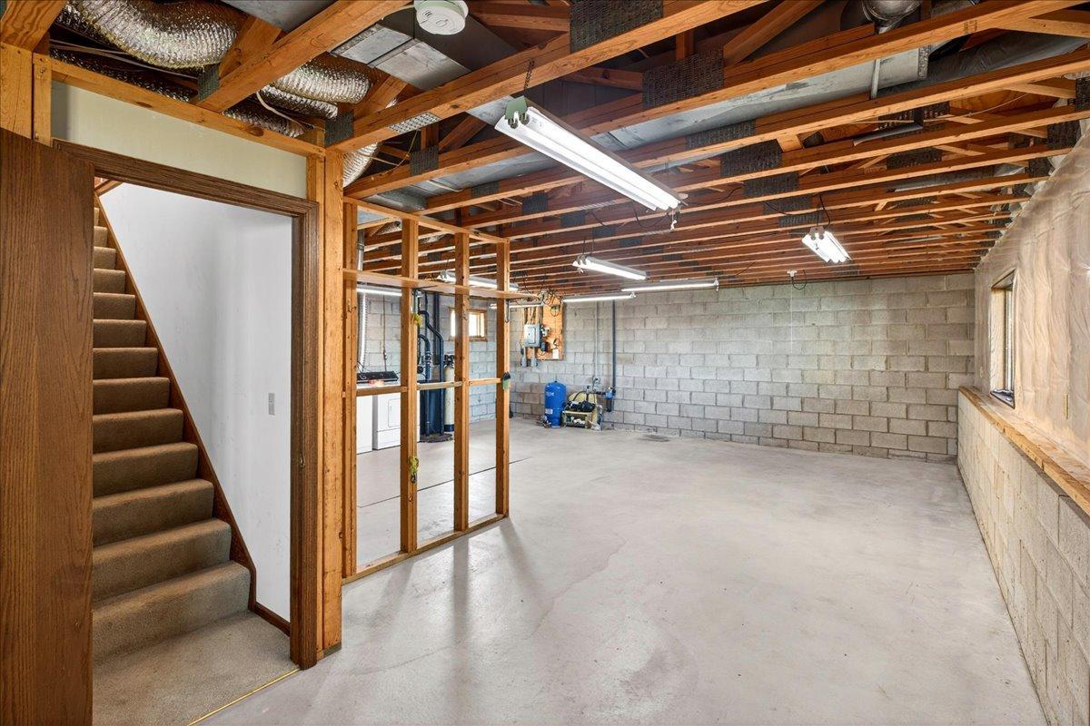 Very clean and expansive unfinished lower level offering excellent storage, workshop space, or future finishing potential.