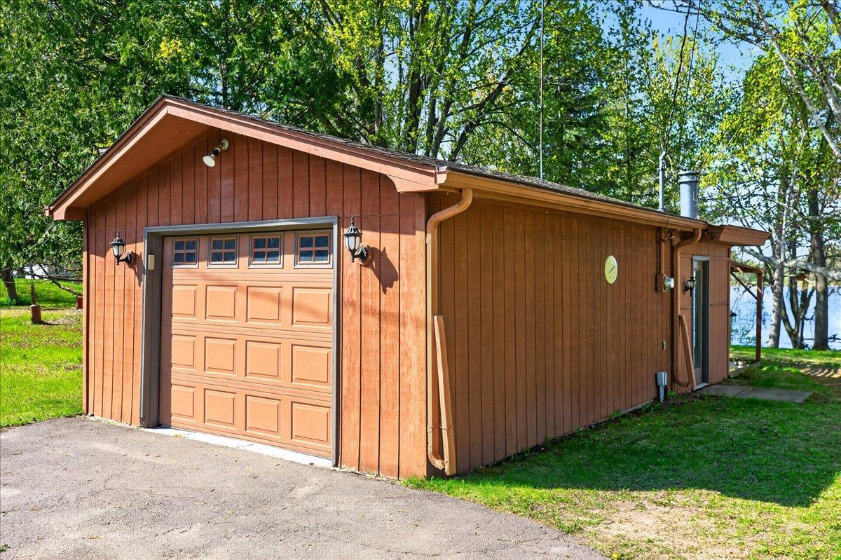 Detached 1-car garage (approximately 20x16) provides excellent storage space for vehicles, lake toys, and outdoor equipment.