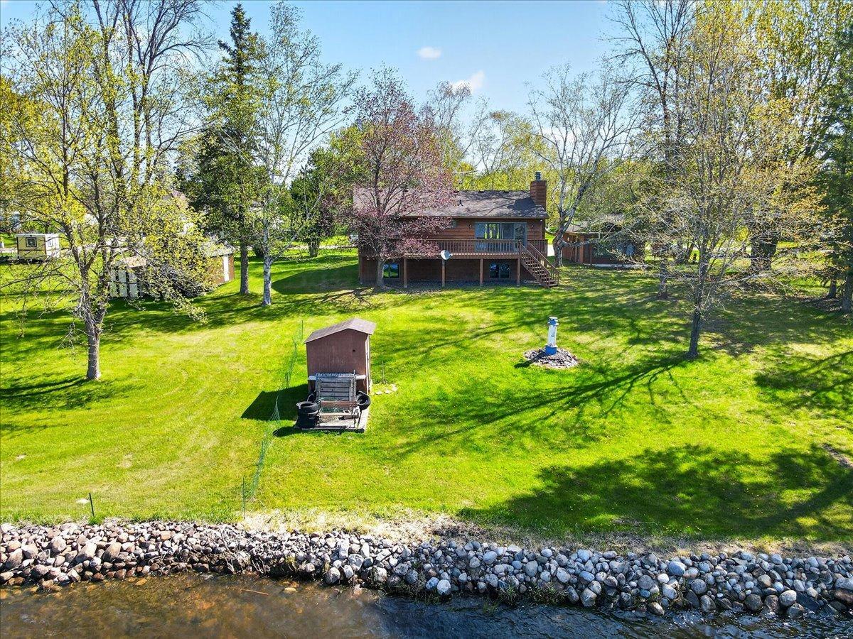 Beautiful lakeside setting featuring shoreline on Rabour Lake with access to the connected Goose Lake Chain of Lakes. Enjoy peaceful lake living with private dock, boat house, and plenty of room to relax, entertain, and enjoy year-round recreation!