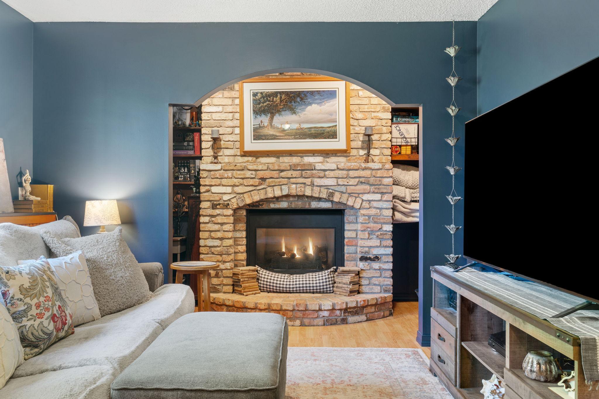 Family room with gorgeous fireplace and rounded archways