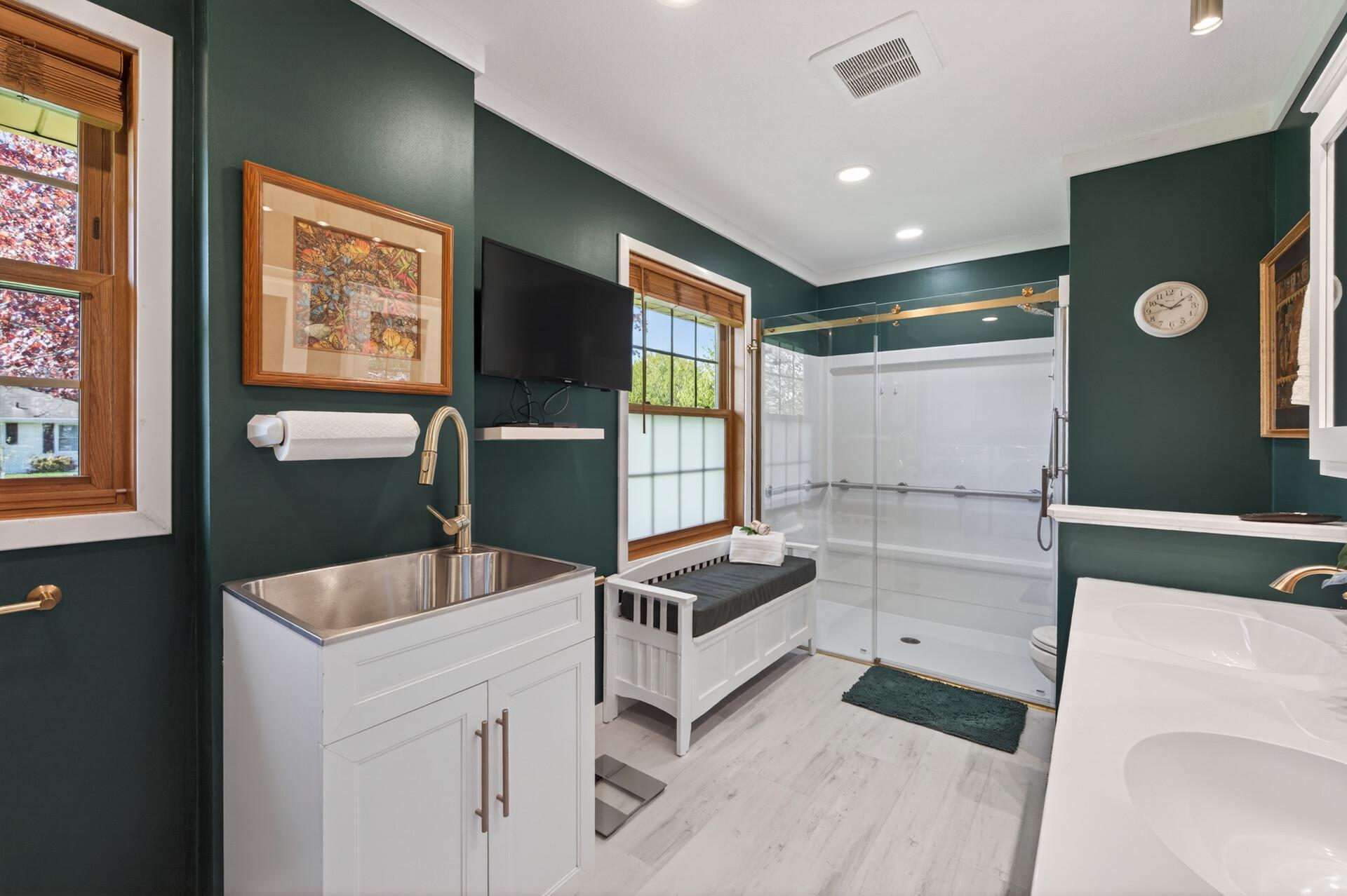 Main floor bathroom has a roll-in shower