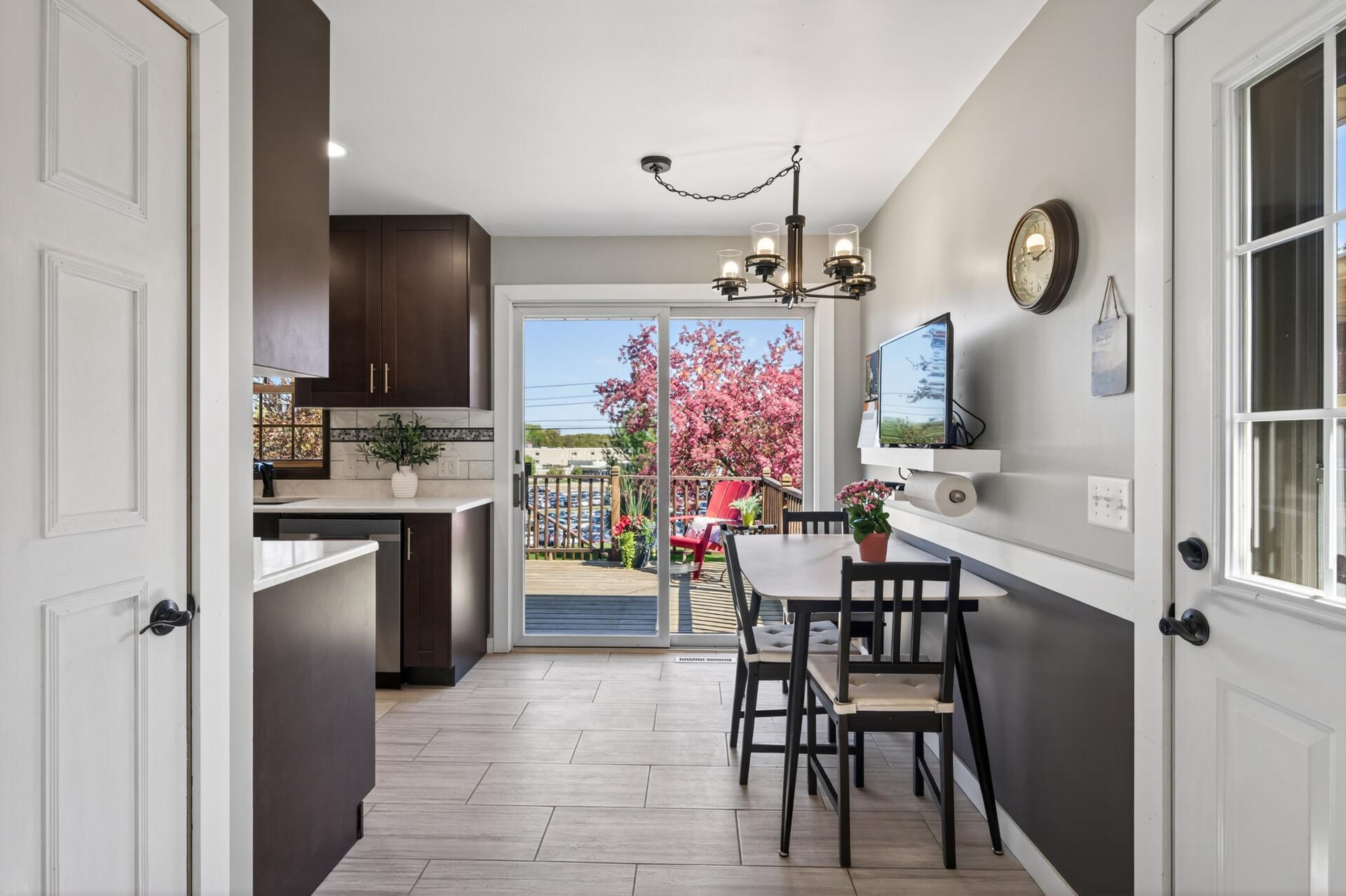 Dining area has access to the side door and the deck