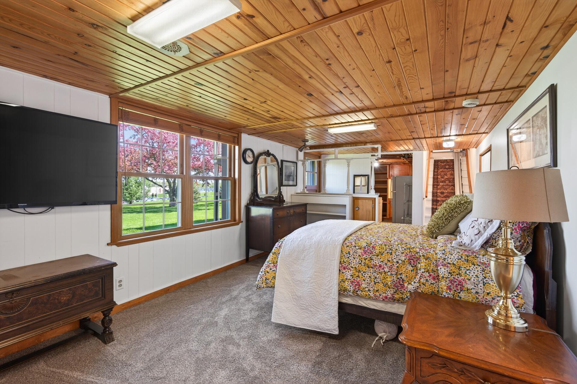 Lower level bedroom hosts a private entrance with access to the backyard