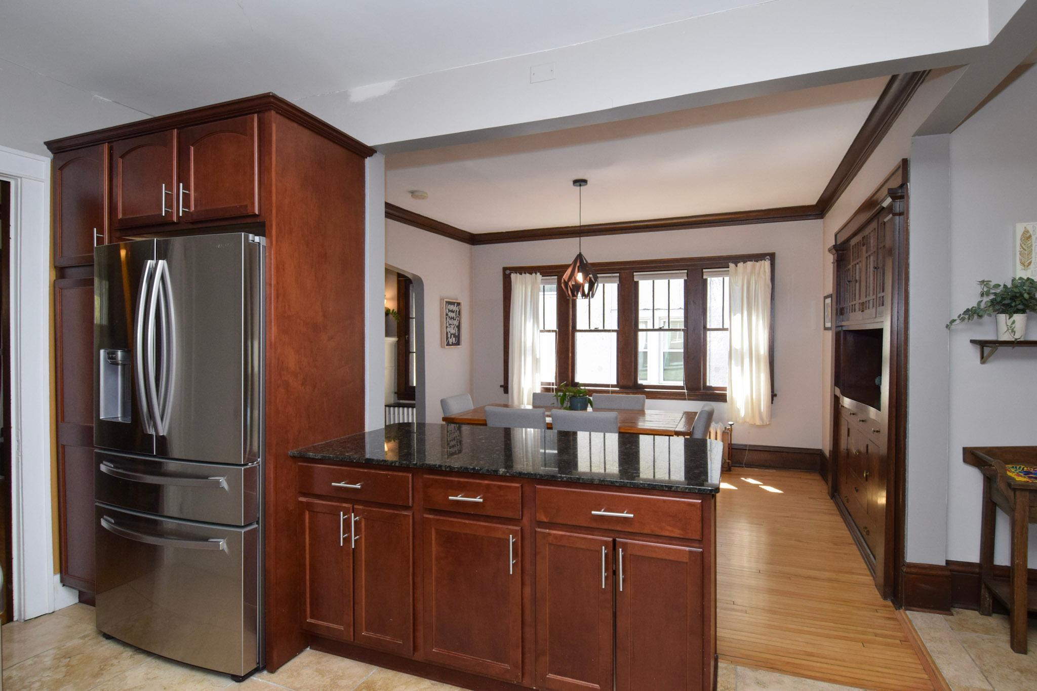 Entertain with ease in this fun, functional kitchen layout-- perfect for preparing meals while staying connected with guests and family.