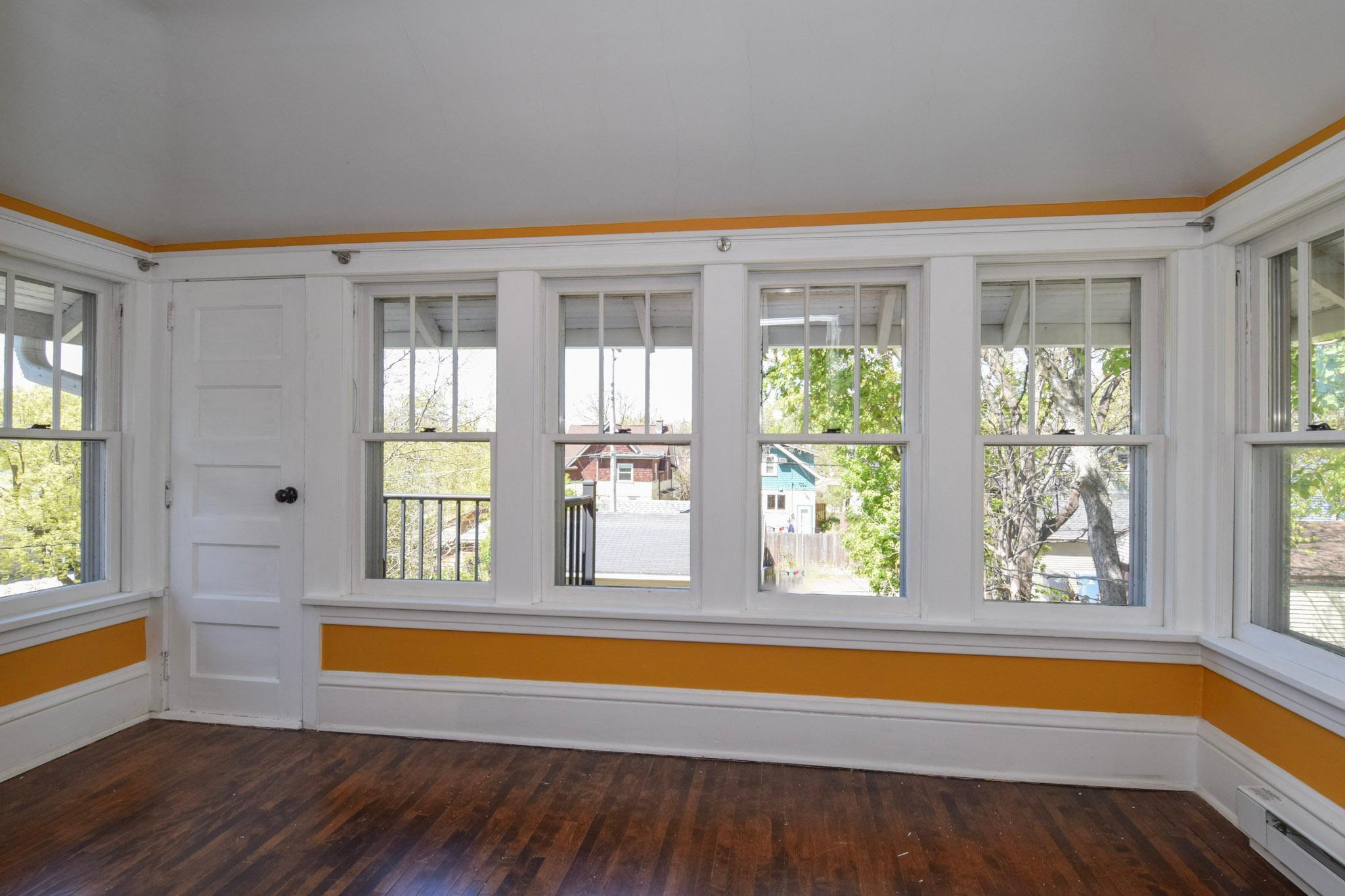 The 4 season porch is located upstairs & overlooks the back yard.