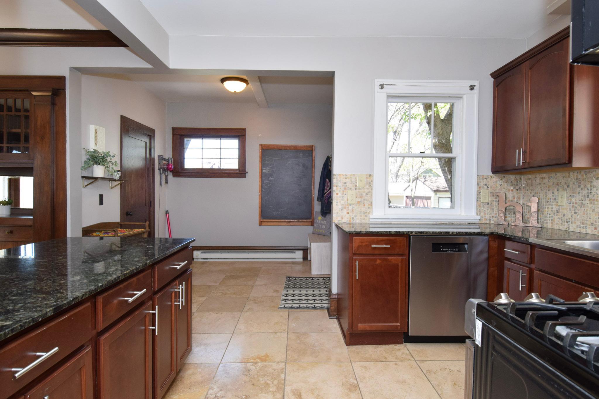Beautiful & easy to clean tile flows from the kitchen to mudroom.