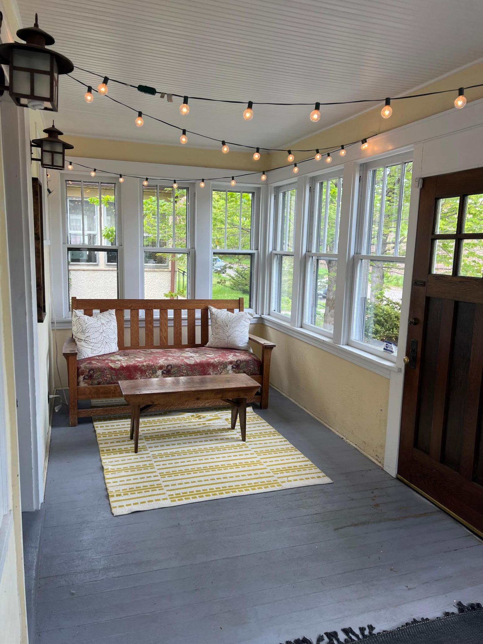 The inviting front porch offers a cozy spot to relax or greet guests as they arrive —