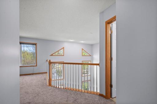 The open loft provides a unique architectural perspective and additional living space on the second floor.
