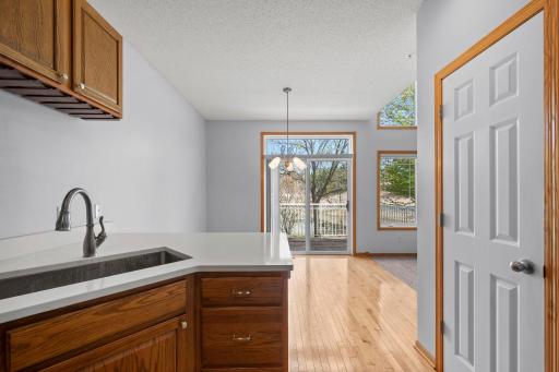 From the kitchen sink, enjoy an open view into the dining area and out toward the private deck.